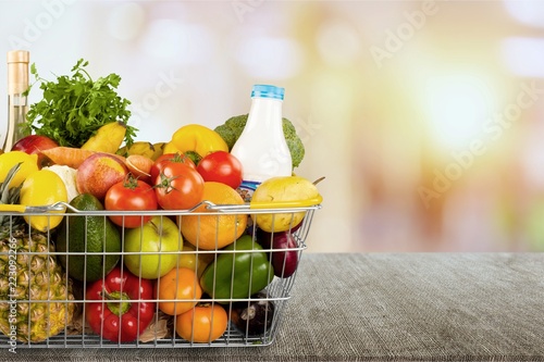 Shopping cart full with various groceries