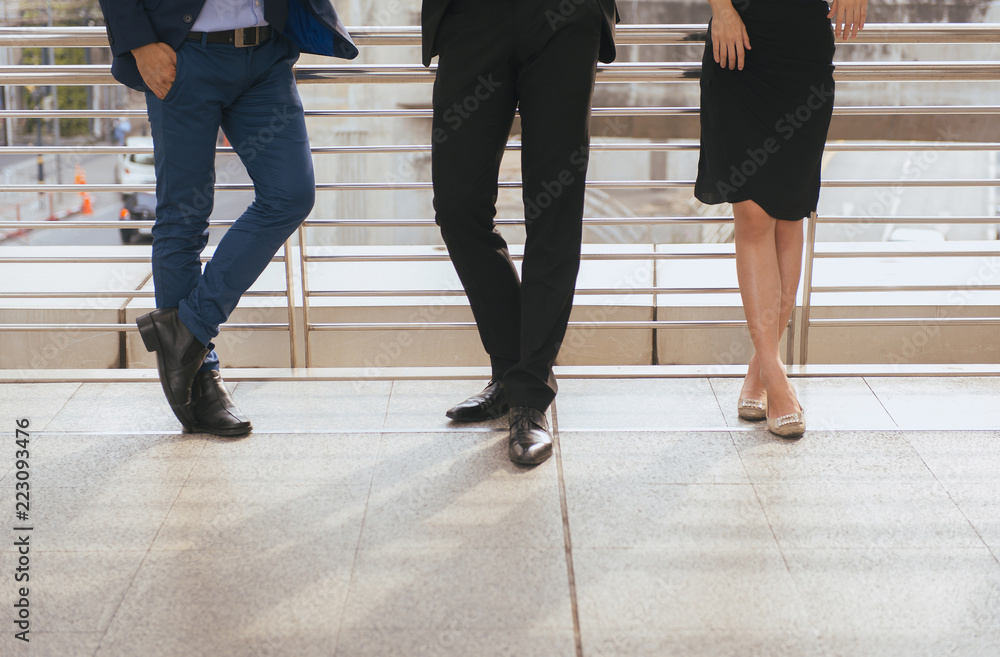 Cropped image of business team working and meeting while standing outdoor Cropped image of business team working and meeting while standing outdoor