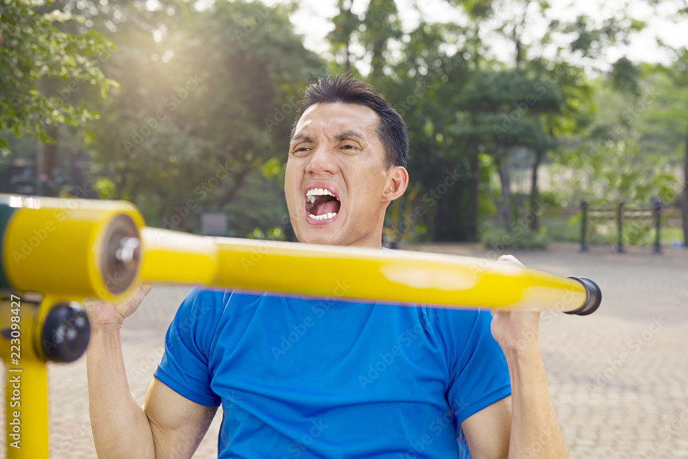 Attractive asian man doing working out Attractive asian man doing working out