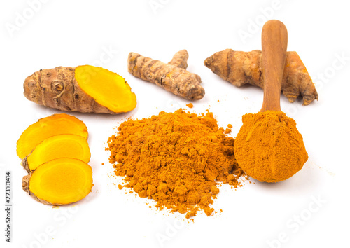 Turmeric powder (Curcuma) and fresh turmeric on white background. Herbs photo