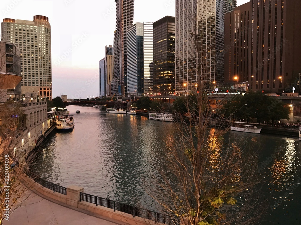 Fototapeta premium City and Skyscraper Views with Water Reflections Nearing Dusk in a Large Metropolis; Architecture, Business Travel, Personal Travel, Vacations, City Style Ideas