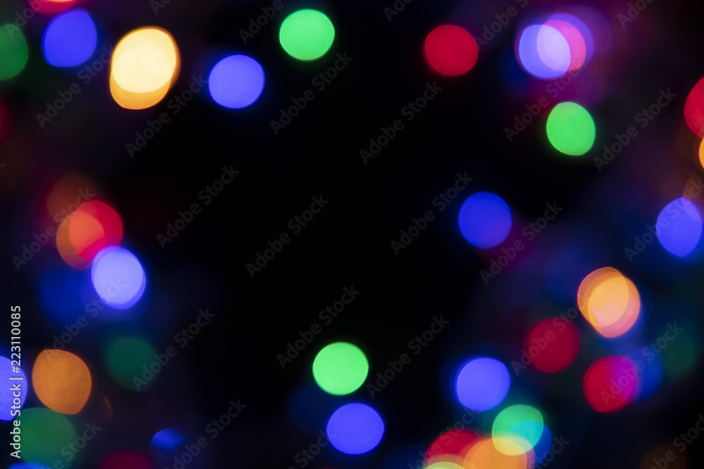 The colors of the lights are flashing blue, green, purple and orange in the form of Bokeh.