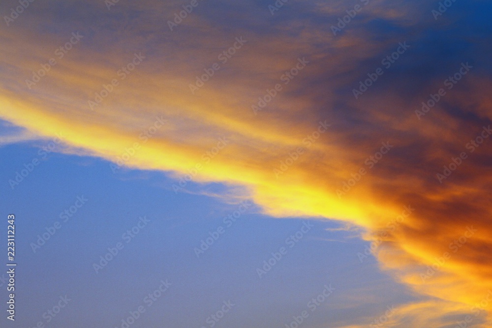 amazing bright sun colored clouds in the sky for using in design as background.
