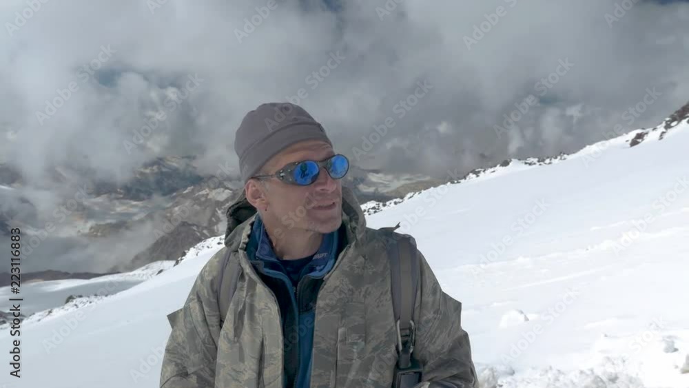 The climber looks at the top with which he came down, and rejoices that he was able to climb it. Mount Elbrus, Caucasus Mountains. The climber looks at the top with which he came down, and rejoices that he was able to climb it. Mount Elbrus, Caucasus Mountains.