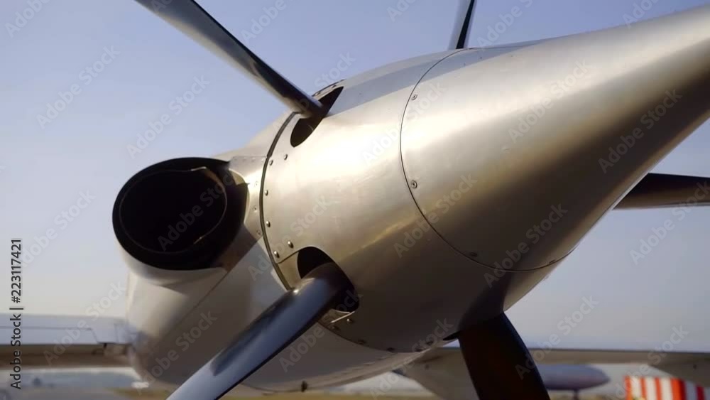 close-up view of aircraft propeller on a plane in airport in sunny day, moving shot close-up view of aircraft propeller on a plane in airport in sunny day, moving shot