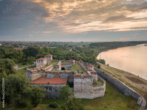 Aerial shot of Baba Vida fortress in Vidin, Bulgaria on the shore of Danube river - impressive and well preserved cultural monument under the golden light of the setting sun