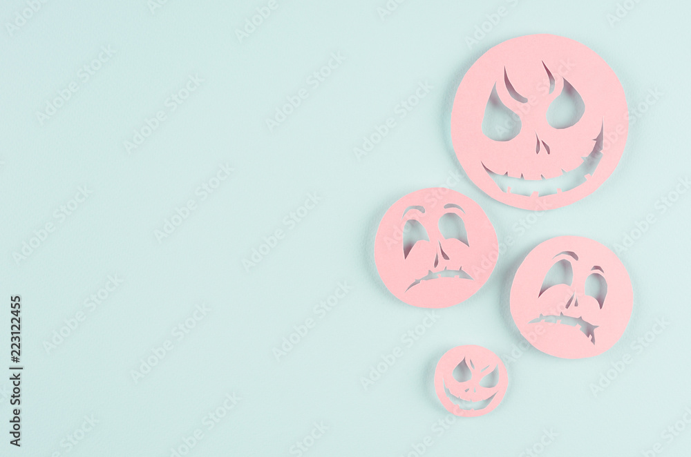 Halloween cartoon mock up for advertising, design, cover - pink paper emoji faces fly on pastel candy mint blue background. Halloween cartoon mock up for advertising, design, cover - pink paper emoji faces fly on pastel candy mint blue background.