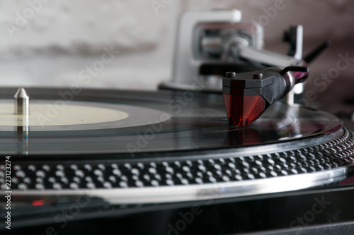 Vinyl record with needle on turntable