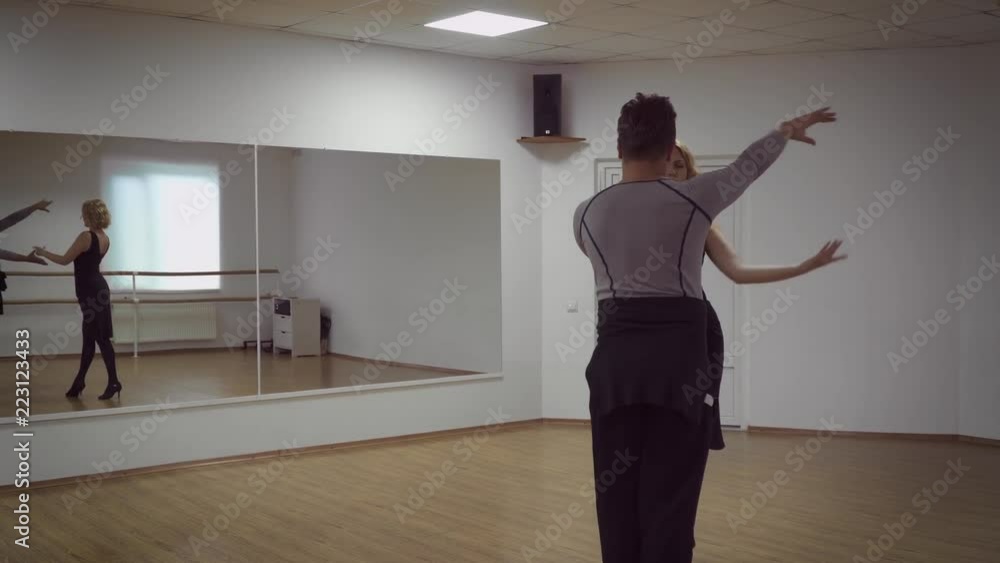 Man and a woman are dancing in the studio Man and a woman are dancing in the studio