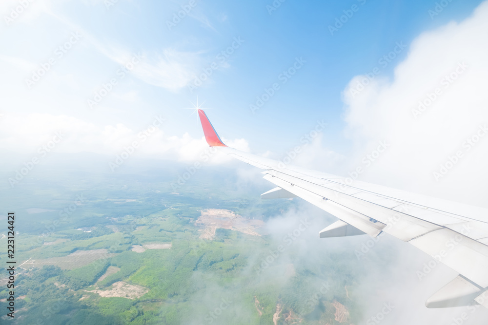 Aircraft wing flying view from window of nature in the morning. Traveling concept. Wing of an aircraft. Aircraft wing flying view from window of nature in the morning. Traveling concept. Wing of an aircraft.
