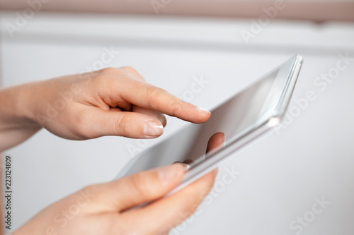 woman holding digital tablet  closeup