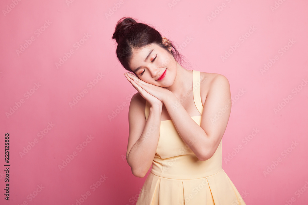 Beautiful young Asian woman with sleeping gesture. Beautiful young Asian woman with sleeping gesture.