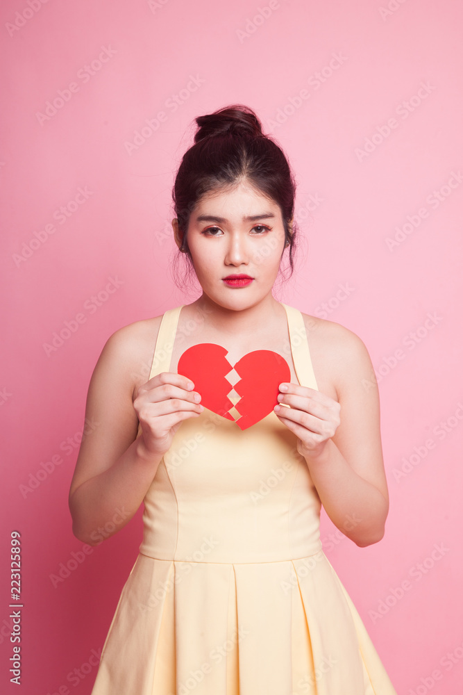 Beautiful young Asian woman with broken heart. Beautiful young Asian woman with broken heart.