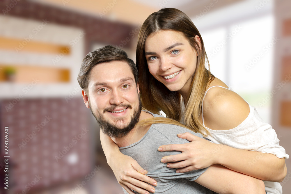 Happy Smiling Couple in love indoors portrait