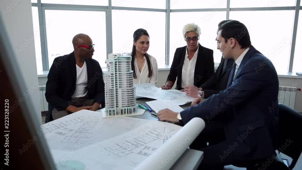 The Discussion is Over. The international businessmen team end the discussion about the project and go away. They discussed a new building, appartment block or a new business centre The Discussion is Over. The international businessmen team end the discussion about the project and go away. They discussed a new building, appartment block or a new business centre