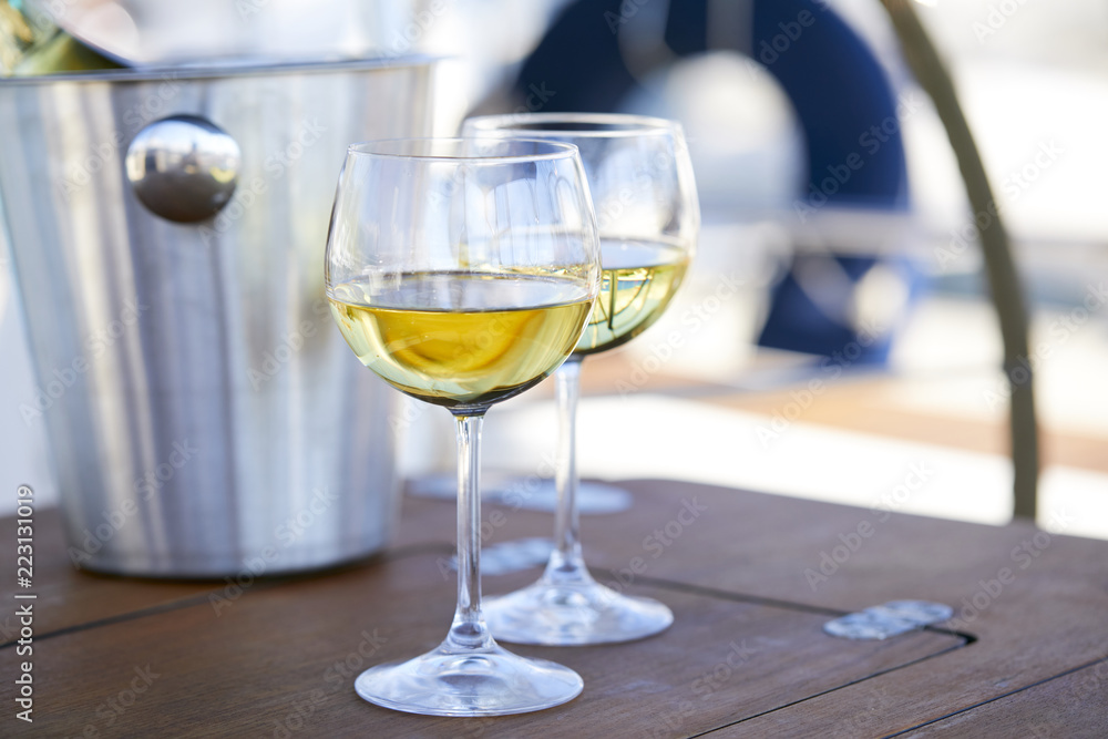 Pair of wineglasses against the yacht Pair of wineglasses against the yacht
