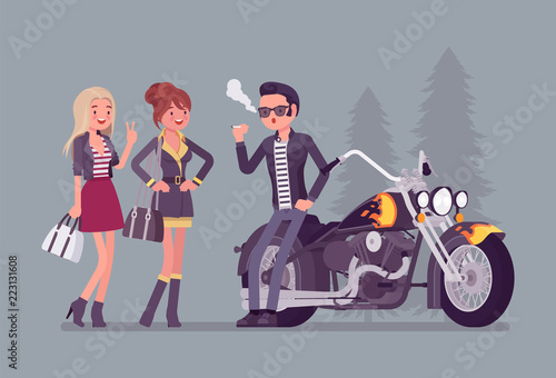 Cool rocker boy in biker leather jacket near chopper