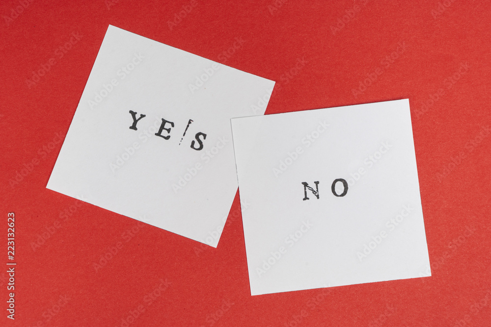 the contrast between the yes and no words printed on two sheets of paper the contrast between the yes and no words printed on two sheets of paper