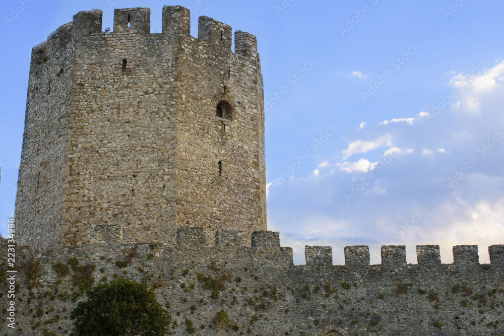 The stone tower and the wall of a castle