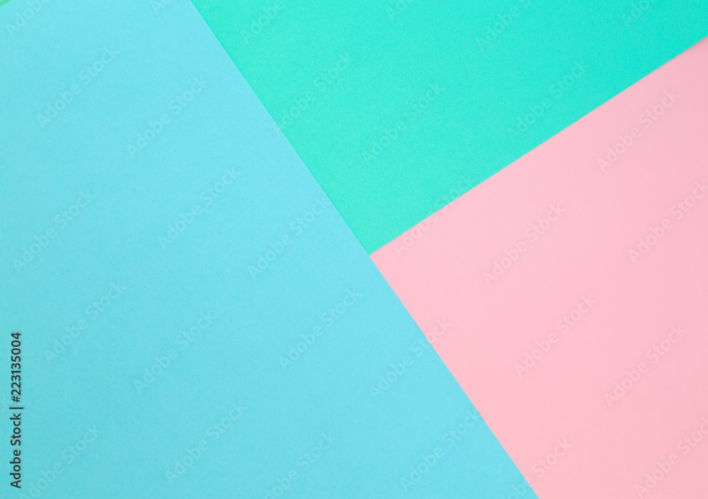 Triangle. Blue, pink and light green color paper background. Image with space for text. Triangle. Blue, pink and light green color paper background. Image with space for text.