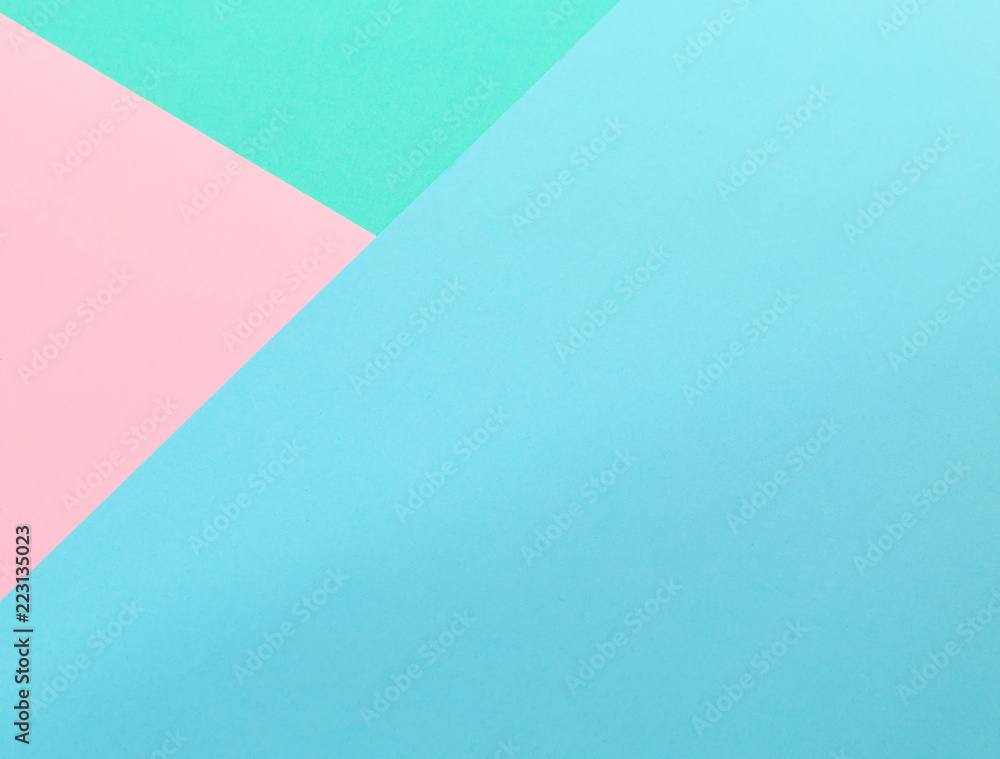 Triangle. Blue, pink and light green color paper background. Image with space for text. Triangle. Blue, pink and light green color paper background. Image with space for text.