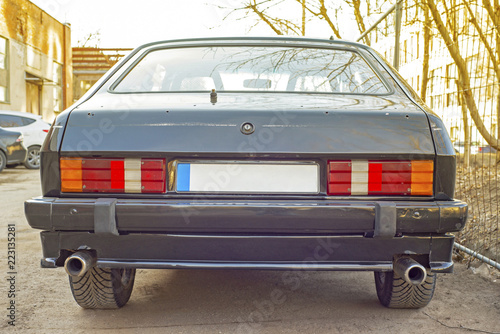 Old abandoned car left in the yard.