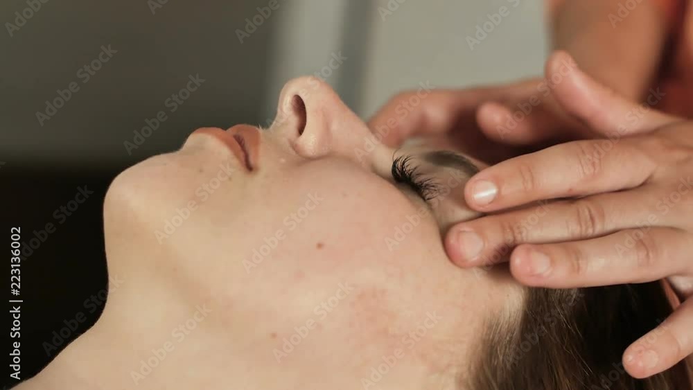 massage the face of a woman, closeup massage the face of a woman, closeup