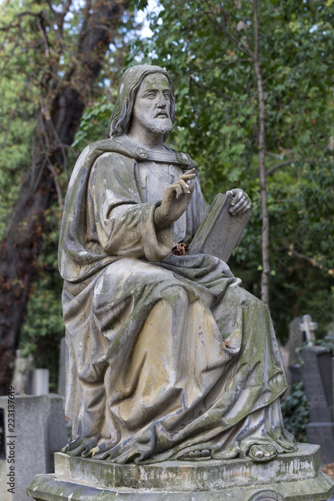 Historic Statue on the mystery old Prague Cemetery, Czech Republic