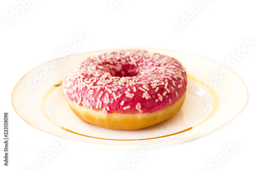 Brightly pink donut on a white background