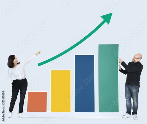 Business people showing development on a graph
