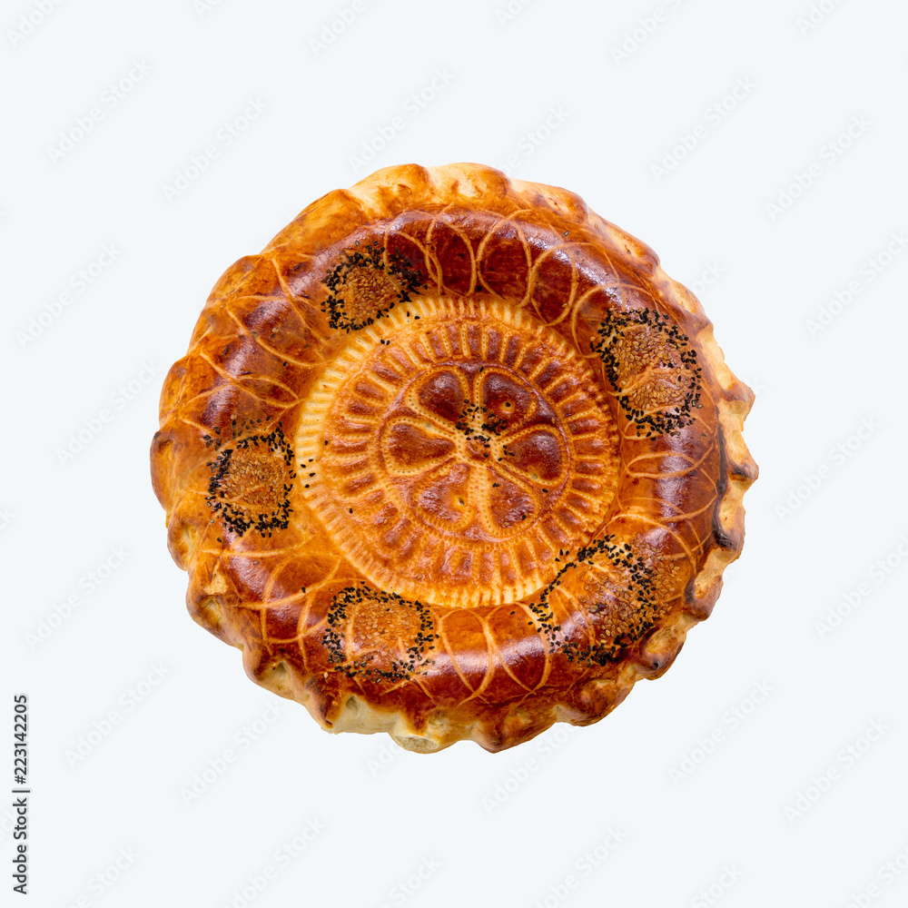 Baked round traditional Asian tandoor bread isolated on white background. Orient, asian, indian cuisine. Baked round traditional Asian tandoor bread isolated on white background. Orient, asian, indian cuisine.