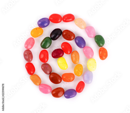 Jelly beans in the form of a spiral on a white background