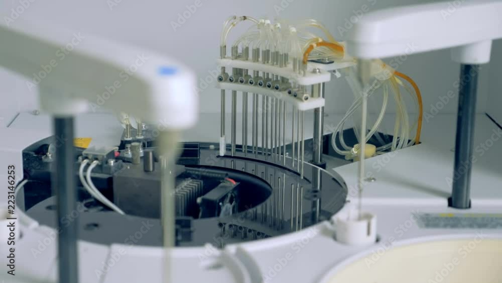 Medical centrifuge works at a hospital with samples. Medical centrifuge works at a hospital with samples.