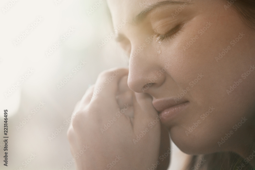 Close-up of face of crying young woman with problem Close-up of face of crying young woman with problem