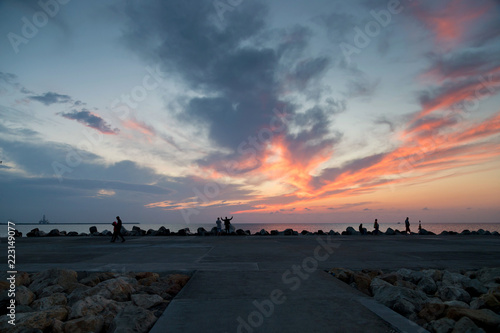 silhouettes of people watching the sunrise at the Black Sea  Romania