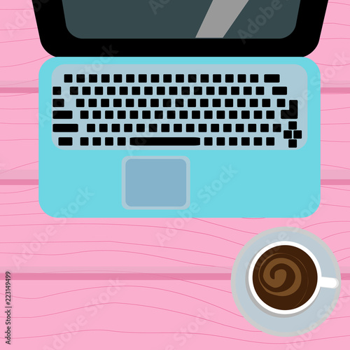 Laptop and coffee cup on a wooden background