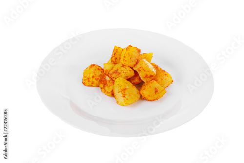 Potatoes diced fried, baked with spices, side dish on a plate on white isolated background Side view. Appetizing dish for the menu restaurant, bar, cafe