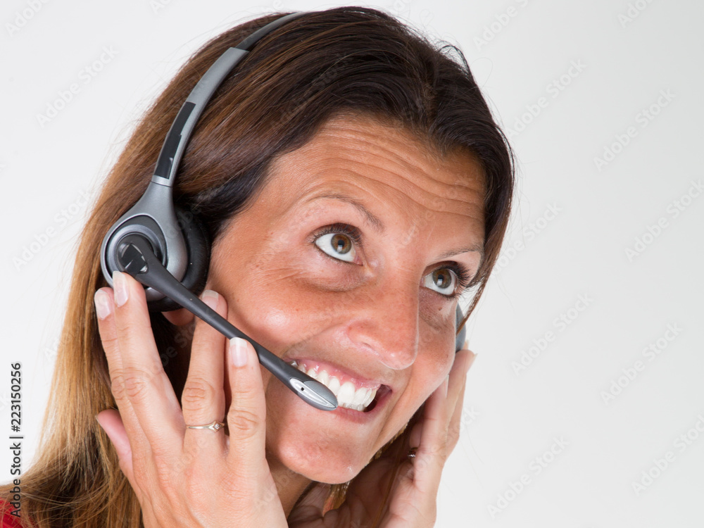 Businesswoman close up with headset smiling customer in call center Businesswoman close up with headset smiling customer in call center