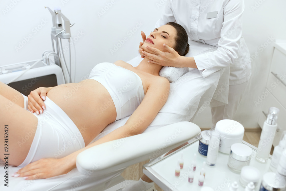 Obraz premium Face Skin Massage. Pregnant Woman At Cosmetology Clinic