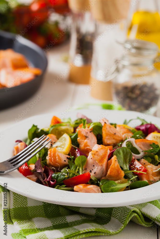 Delicious salad with pieces of grilled salmon. Delicious salad with pieces of grilled salmon.