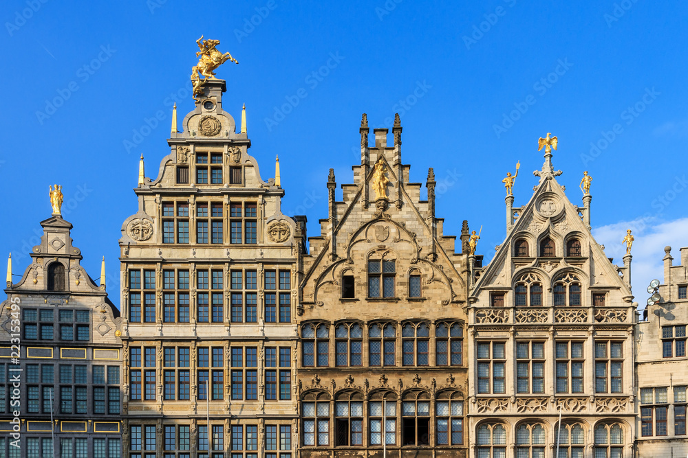 Beautiful historic facades of the manor houses at the Great Market square (Grote Markt) in Antwerp, Belgium, in summer against a blue sky
