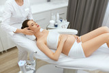 Face Cosmetology. Facial Massage For Pregnant Woman At Clinic