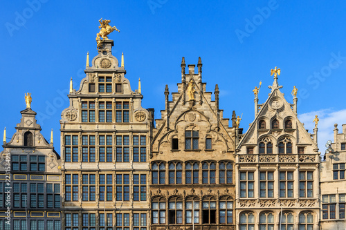 Beautiful historic facades of the manor houses at the Great Market square (Grote Markt) in Antwerp, Belgium, in summer against a blue sky