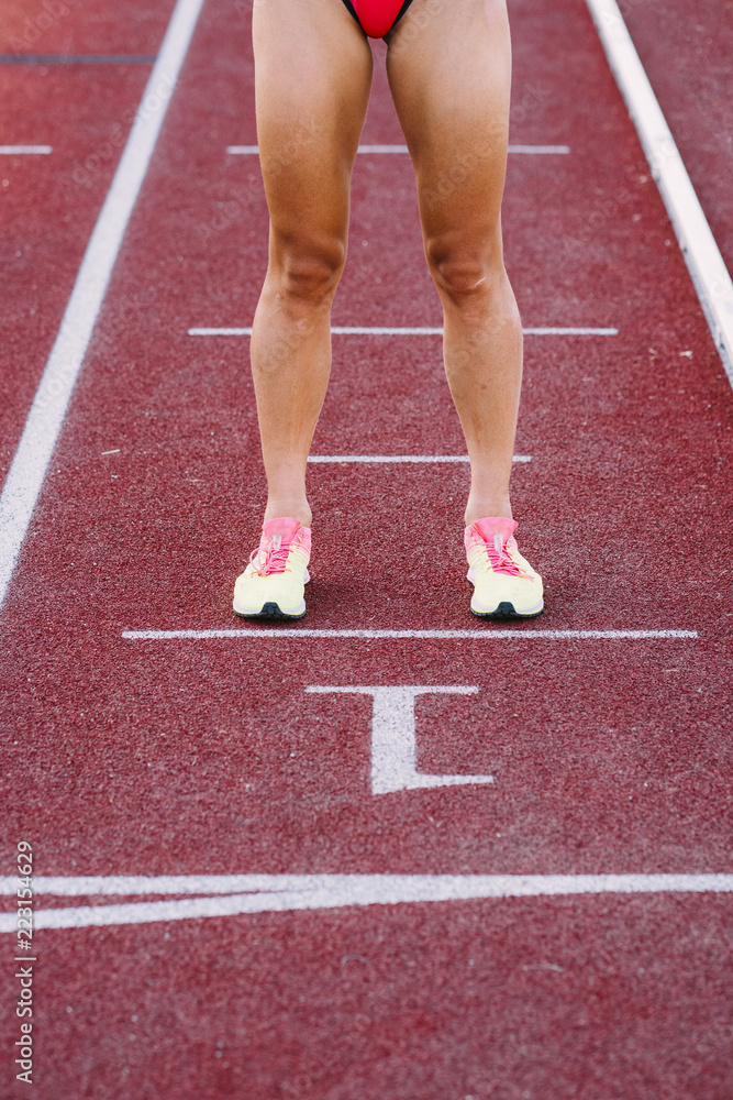 Close-up of the legs of a runner woman