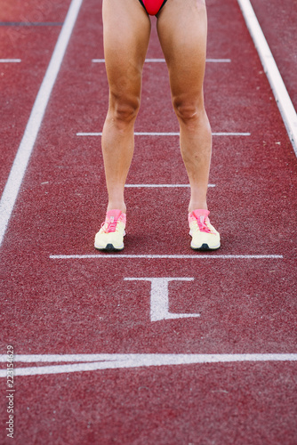 Close-up of the legs of a runner woman