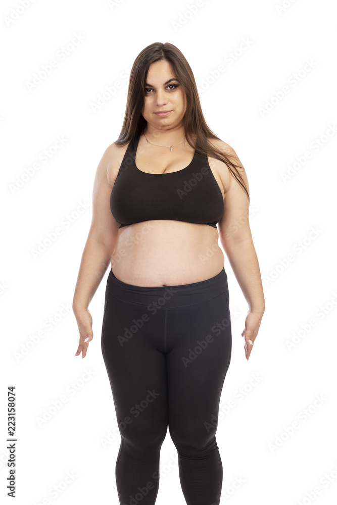 Thick woman in sportswear, isolated on white background Thick woman in sportswear, isolated on white background