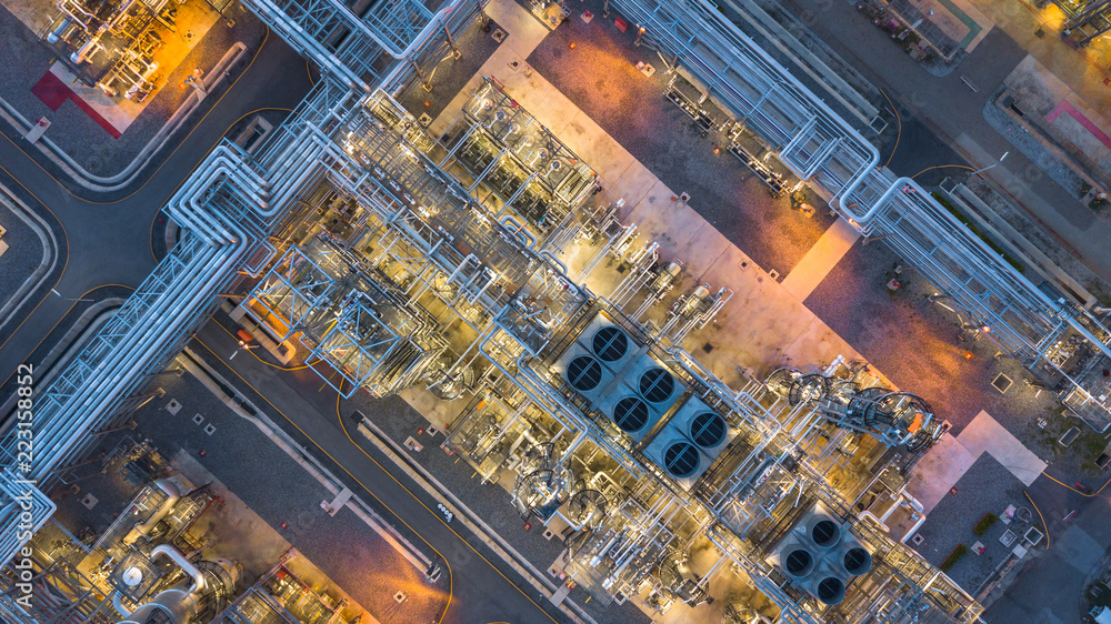Aerial top view oil and gas refinery plant form industry zone at night ...