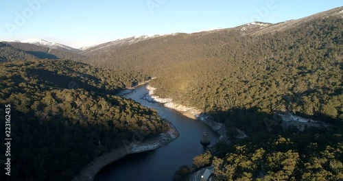 Snow gums covered slopes of mountain ranges around Guthega dam on Snowy river in Snowy mountains.
 photo