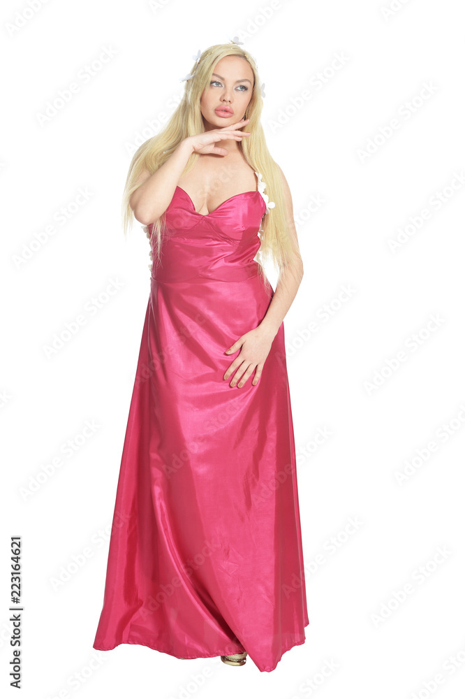 Portrait of beautiful woman in pink dress posing