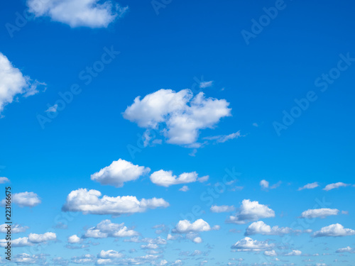 Photography many little puffy clouds in blue sky in sunny day